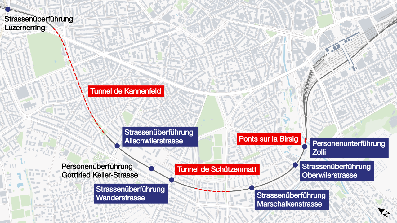L’illustration est une carte des passages supérieurs et inférieurs, ainsi que des tunnels et des ponts dans une zone urbaine. Les passages inférieurs et supérieurs sont indiqués en bleu, tandis que les deux tunnels de Kannenfeld et de Schützenmatt sont en rouge, de même que les ponts sur la Birsig. Les noms des rues et des ouvrages sont clairement indiqués. 