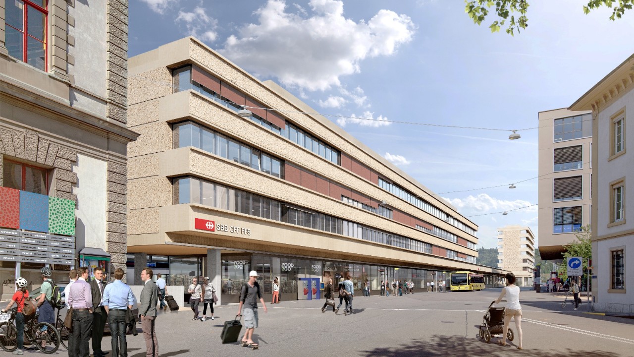 Die Visualisierung zeigt das künftige Bahnhofgebäude vom Kantonsgericht am Bahnhofplatz in Richtung Basel gesehen.