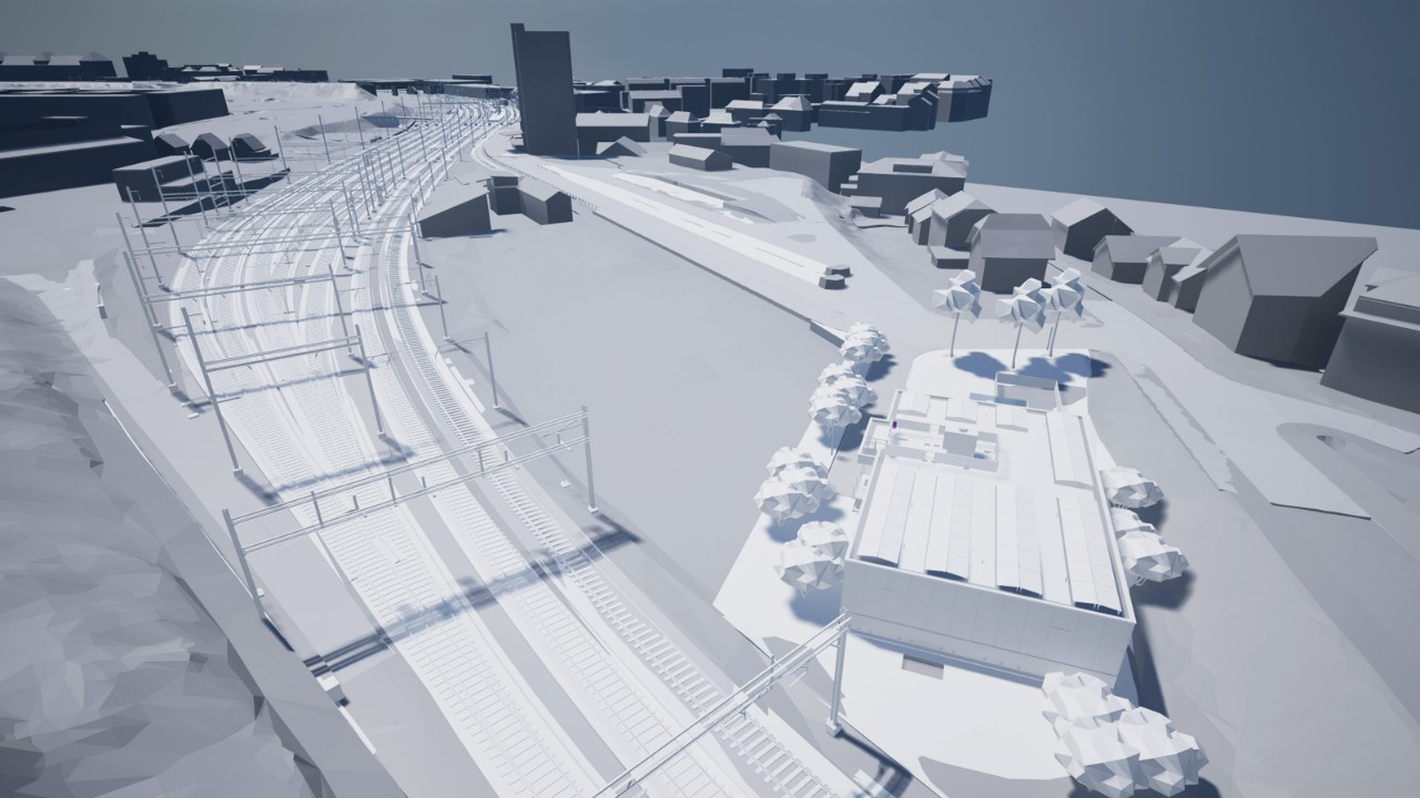 Die Visualisierung zeigt aus erhöhter Vogelperspektive die Gleisanlagen mit mehreren Fahrspuren, Oberleitungen und der angrenzenden Bebauung. Rechts ist ein neues Bahntechnikgebäude beim Freiverlad dargestellt, umgeben von Zufahrtswegen und Bäumen. Die schematische Darstellung ordnet das Bauwerk und die Bahninfrastruktur im bestehenden Quartier ein.