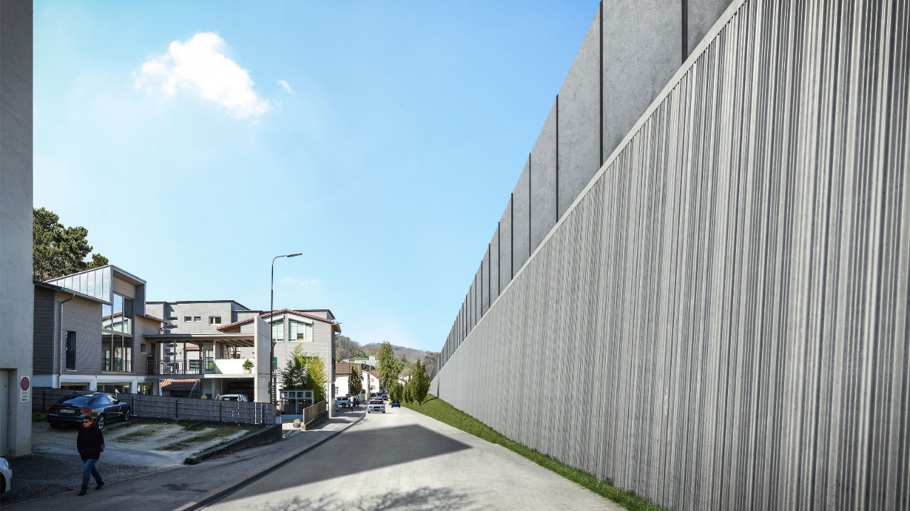 Die Visualisierung zeigt die neue Stützmauer an der Wiedenhubstrasse, von der Wiedenhubstrasse in Richtung Basel gesehen.